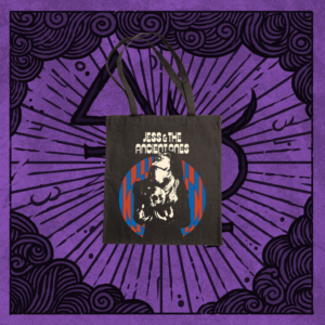 Jess and the Ancient Ones black Tote Bag Born to Kill on purple background. Pic on bag is white woman with skull on lap inside of blue and red stripes on circle shape.
